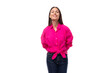 well-groomed young employee office woman dressed in a pink stylish shirt on a white background with copy space
