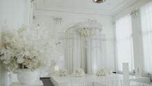 Medium Shot Wedding Arch Decorated In White Color And White Floral Composition. Wedding Concept, Slow Motion
