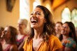 A happy laughing woman in a church. Warm and welcoming atmosphere.