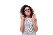 © Ivan Traimak - young caucasian woman with curly hair styling dressed in a short sleeve summer blouse crossed her fingers in anticipation