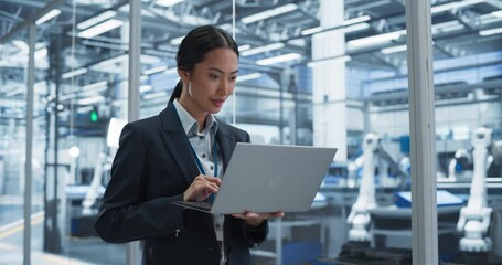 Poster - Thoughtful Asian Engineer Monitoring and Analyzing Conditions at a Pristine Modern Electronics Factory with Automated Robot Hands Working with the Help of Artificial Intelligence Software
