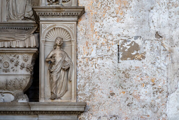 Sticker - Detail of sculpture carved in marble representing a bare-breast woman decorating the exterior facade of old building in Rome