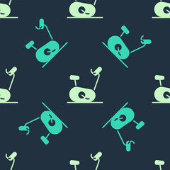 Sticker - Green and beige Stationary bicycle icon isolated seamless pattern on blue background. Exercise bike. Vector