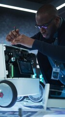 Fototapete - Vertical Screen: Close Up of an Engineer Using a Screwdriver While Developing a Remotely Controlled Delivery Robot. Black Specialist Working in High Tech Research Laboratory with Modern Equipment