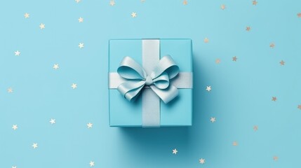 Poster - A nice gift box decorated craft papper with a bow on blue background. New Year, Christmas, birthday, Valentines Day, World Womans Day, Fathers Day. top view