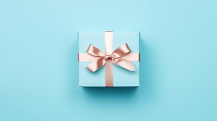 Poster - A nice gift box decorated craft papper with a bow on blue background. New Year, Christmas, birthday, Valentines Day, World Womans Day, Fathers Day. top view