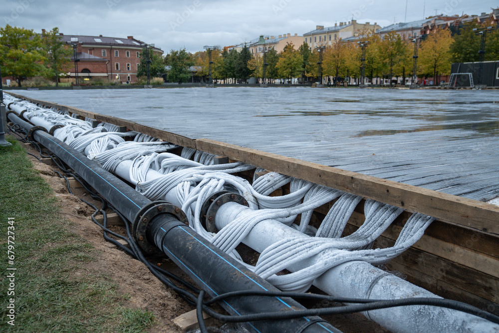 Foto de Stock Preparation of outdoor skating rink for winter seasonal ...
