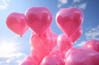 Heart shape pink balloons. Valentine's Day or Mother's Day elements against blue sky background