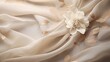 Soft beige silk creating a neutral canvas embellished with minimalist white floral design. Mothers day, glamour, wedding, luxury. 