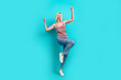 © deagreez - Full length photo of pretty cheerful girl dressed striped tank top having fun dancing isolated teal color background