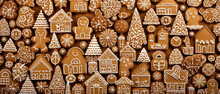 Christmas Gingerbread Cookies On A Wooden Background. Decorated With Snowflakes And Garlands.