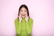 © Parichat - Shouting with mouth wide open, friendly young woman, Portrait of a beautiful young woman in a light pink background, happy and smile, posting in stand position.