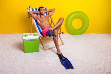 Sticker - Full length photo of positive good mood masculine guy sun bathing lounge chair arms behind head isolated yellow color background