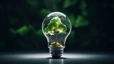 Fototapeta  - Green Alternative energy in the form of a Green tree concept inside a light bulb ecology and energy conservation, reasonable consumption and friendliness to the environment photography