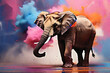 Elefant in einer Wolke aus Farben schwenkt seinen Rüssel