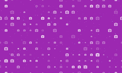 Poster - Seamless background pattern of evenly spaced white photo camera symbols of different sizes and opacity. Vector illustration on purple background with stars