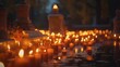Burning candles on the cemetery at night. Selective focus.