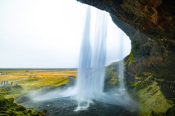  view from behind the waterfall; Seljalandfoss on the ring road, Iceland