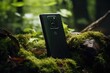 water resistant smartphone stands amidst moss and foliage in a serene forest setting, blurred background