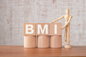Poster - There is wood cube with the word BMI. It is an abbreviation for Brain Machine Interface as eye-catching image.