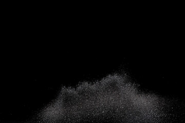 Explosion metallic black glitter sparkle. Dark Glitter powder spark blink celebrate, blur foil explode in air, fly throw black glitters particle. Black background isolated, selective focus Blur bokeh