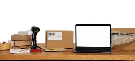 Canvas Print - Parcels, laptop and barcode scanner on wooden table against white background. Online store