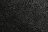 Fototapeta Most - Texture of dark grey stone surface as background, closeup