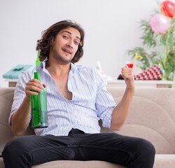 Wall Mural - Young man celebrating his birthday at home