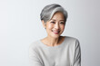 Beautiful grey hair asian woman smiling with smooth face skin.