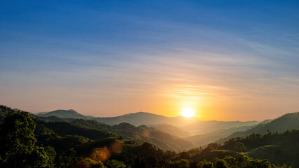 Wall Mural - Beautiful mountains valley view with sunset sky background. Nature picture countryside landscape