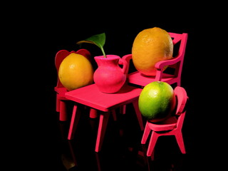 Wall Mural - Composition with three lemons at the table on a black background