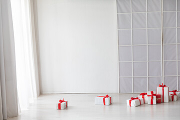 Wall Mural - A lot of red gifts for the holiday in the interior of a white room