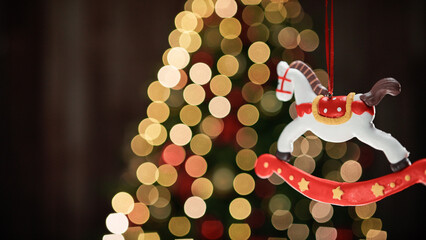 Wall Mural - Carousel horse Christmas decoration with blurred tree