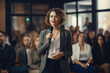 © Anastasiia - Female Entrepreneur Giving Seminar In Front Of Audience