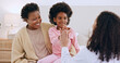 © Charlize D/peopleimages.com - Mother, daughter or doctor and high five or happiness in bedroom with support, trust and healthcare. Black family, women or pediatrician with success or smile for wellness and health results