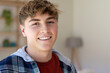 © Wavebreak Media - Portrait of happy caucasian male teenager with short blond hair at home