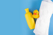 Towel, baby shampoo, and rubber duck, hygiene care for newborns, adorable bath set
