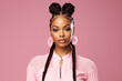 © Surachetsh - The portrait of an attractive young black female model in pink outfit  with braids hairstyle and full makeup isolated on a pink background, shot in a studio. Generative AI.