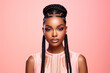 © Surachetsh - The portrait of an attractive young black female model in pink outfit  with braids hairstyle and full makeup isolated on a pink background, shot in a studio. Generative AI.