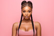 © Surachetsh - The portrait of an attractive young black female model in pink outfit  with braids hairstyle and full makeup isolated on a pink background, shot in a studio. Generative AI.