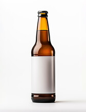 Brown Beer Bottle With A White Empty Label Stands On A Light Gray Background With A Shadow