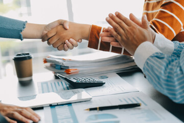 Wall Mural - Business handshake for teamwork of business merger and acquisition,successful negotiate,hand shake,two businessman shake hand with partner to celebration partnership and business deal concept