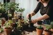 © Ilia - Young female woman gardener growing plants and holding pot in greenhouse and plant nursery. Home gardening concept