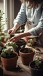 © Ilia - Young female woman gardener growing plants and holding pot in greenhouse and plant nursery. Home gardening concept