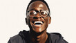 © Mosaic Media - A beaming Black man with glasses, photographed against a simple white background.