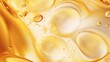 Close-up of golden oil bubbles, ideal for skincare and beauty product backgrounds.