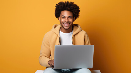 smiling cheerful smart young ginger man wearing casual teenage clothes using laptop computer pose lo