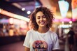 © CogniLens - Portrait of a grinning woman in her 20s sporting a vintage band t-shirt against a vibrant shopping mall background. AI Generation