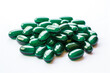 green pills close-up on a white background