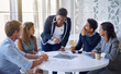 © ArcursJointTeam/peopleimages.com - Business people, meeting and discussion in office for planning, collaboration and technology by table. Employees, men and women at corporate workplace with communication and brainstorming with ideas